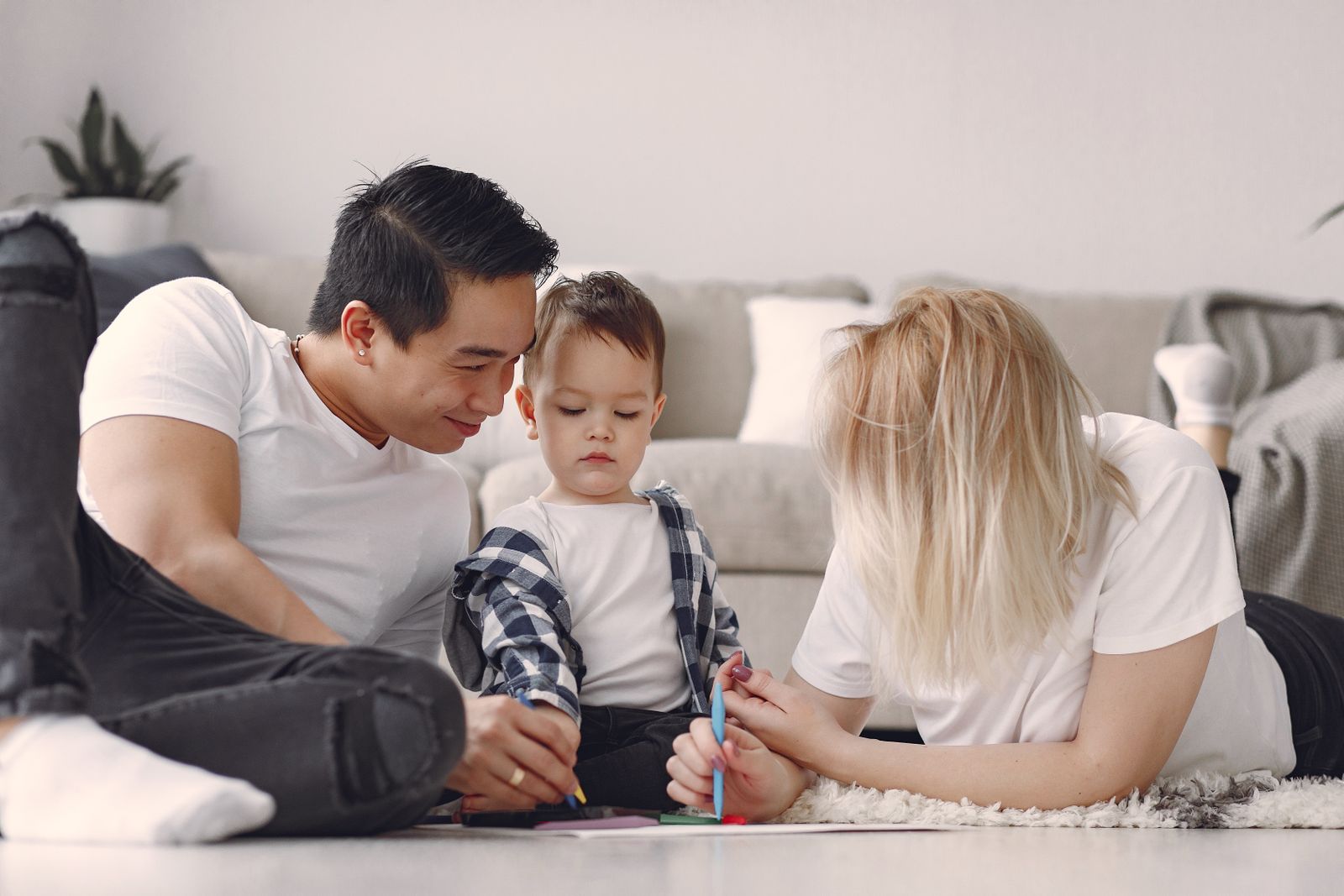 A family at home in a bright living room